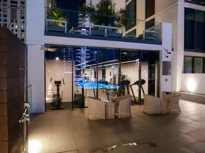 a group of chairs sitting in front of a building at Full Dubai Marina View 2BR Apartment in Dubai