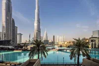 a view of a city skyline with a large swimming pool at Stunning 2BR with Burj Lake View at The Residences in Dubai