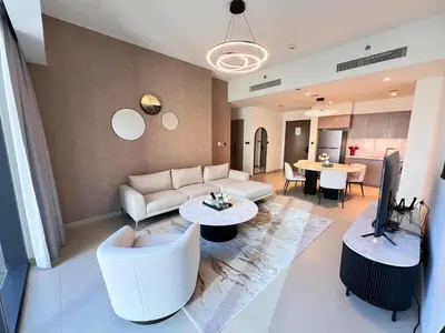 a living room with a couch and a table at 2BR next to Dubai mall with Khalifa Tower view! in Dubai