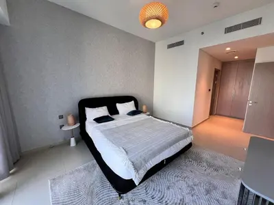 a bedroom with a large bed in a room at 2BR next to Dubai mall with Khalifa Tower view! in Dubai