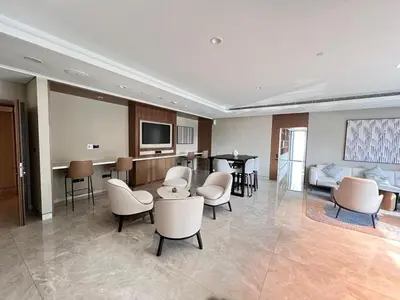 a hospital room with chairs and a couch and a table at 2BR next to Dubai mall with Khalifa Tower view! in Dubai