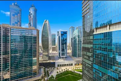 a view of a city skyline with tall buildings at Modern Flat close to Burj Khalifa with stunning pool in Dubai