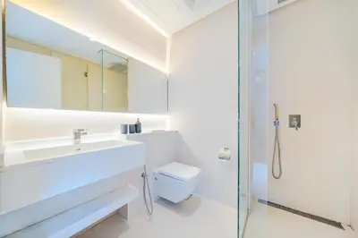 a bathroom with a toilet and a sink and a shower at Modern Studio with Skyline Views in Dubai Marina in Dubai