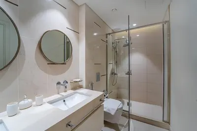 a bathroom with a sink and a shower at 2BR with Atlantis View, Beach Access, and Infinity Pool in Dubai