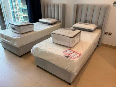 three beds are covered in plastic in a room at Marina Gate, Full Marina View, Excellent Location, Dubai Marina in Dubai Marina