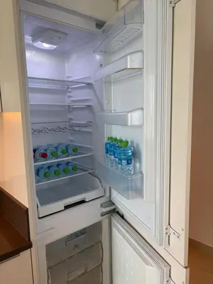 an open refrigerator with bottles of water in it at Marina Gate, Full Marina View, Excellent Location, Dubai Marina in Dubai Marina