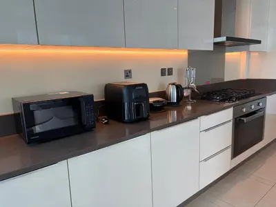 a kitchen with a microwave and a toaster oven at Marina Gate, Full Marina View, Excellent Location, Dubai Marina in Dubai Marina