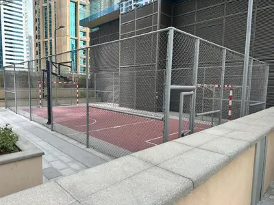 a tennis court inside of a tennis court at Marina Gate, Full Marina View, Excellent Location, Dubai Marina in Dubai Marina