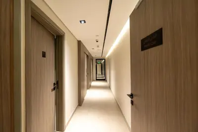 an empty hallway with a sign on the door at Venetian - Elegant 1BR in JVC & Perfect for Work Leisure in Dubai
