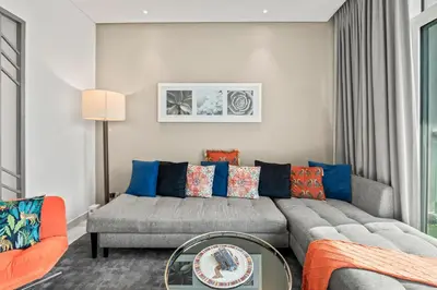a living room with a couch and a table at Luxury Apartment with canal view - near to Burj Khalifa - Dubai in Dubai