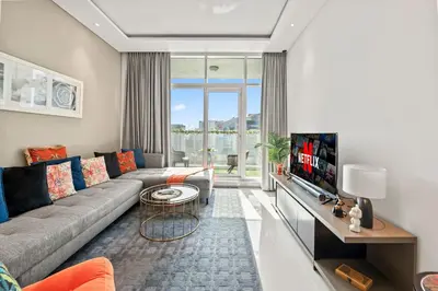 a living room with a couch and a tv at Luxury Apartment with canal view - near to Burj Khalifa - Dubai in Dubai