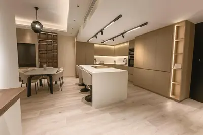 a kitchen with a table and a dining room at Burj, Canal & Dubai Mall Luxe Stay for 6 in Dubai