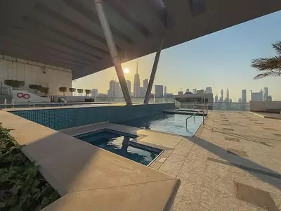 a swimming pool on a building with a view of the city at Burj, Canal & Dubai Mall Luxe Stay for 6 in Dubai