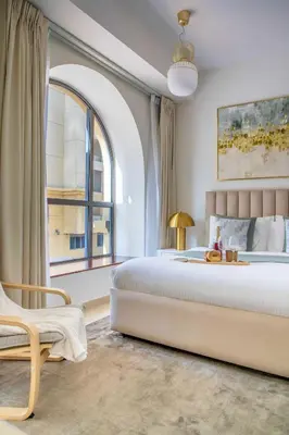 a bedroom with a large bed and a window at Frank Porter - Bahar 6 in Dubai