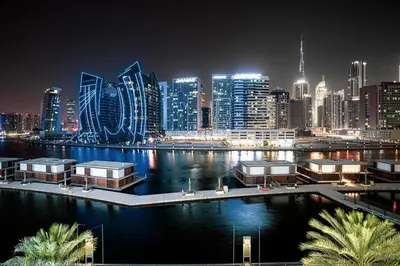 a view of a city skyline at night at Waves - Chic Business Bay 1BR - Bright and Modern in Dubai