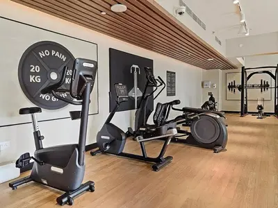 a gym with several exercise bikes in a room at Extra Luxury High Floor Skyline View Stylish in Dubai