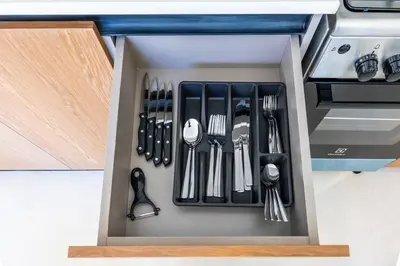 a drawer filled with utensils in a kitchen at Extra Luxury High Floor Skyline View Stylish in Dubai
