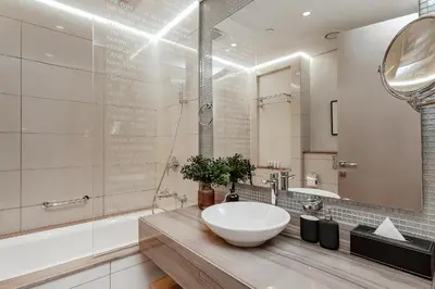 a bathroom with a white sink and a mirror at Luxury Living at Paramount Tower B, Business Bay in Dubai