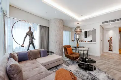 a living room with a couch and a table at Luxury Living at Paramount Tower B, Business Bay in Dubai