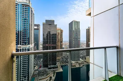 a view of a city from the balcony of a building at Escape24 Luxury 2BR with Large Balcony and Lake Views in Dubai