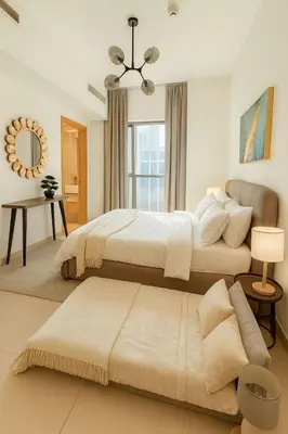a large bedroom with two beds and a couch at Burj Khalifa View 1BHK 5 people Downtown Dubai in Dubai