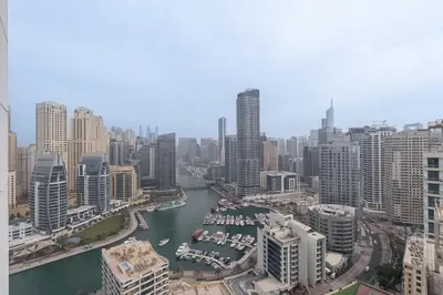 a view of a city with a river and buildings at Chic 2BHK Retreat with Marina Views by Czechin in Dubai