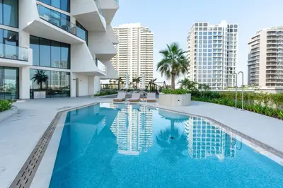 an image of a swimming pool in a building at The Royale Blue Suite 610 I JVC I Plunge Pool Parking Gym in Dubai