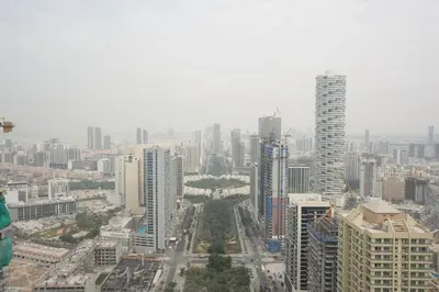 an aerial view of a city with tall buildings at The Royale Blue Suite 610 I JVC I Plunge Pool Parking Gym in Dubai