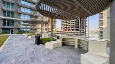 a view of a building with benches on the roof at TRPS - Beach Isle Tower 1, Dubai Harbour - Seaside Residence, Private Beach, Palm View in Dubai