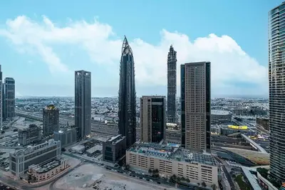 a view of a city with tall buildings at Modern 4BR Suite Overlooking Downtown in Dubai