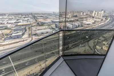 a view of a highway from the top of a glass tower at Samaya Holiday Homes - Cloud Stylish Suites with Balcony in Dubai