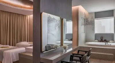a hotel room with two beds and a bath tub at Burj Khalifa View High Floor and Brand New in Dubai