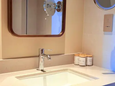 a bathroom with a sink and a mirror at Center to Burj Khalifa I Brand New I High End in Dubai