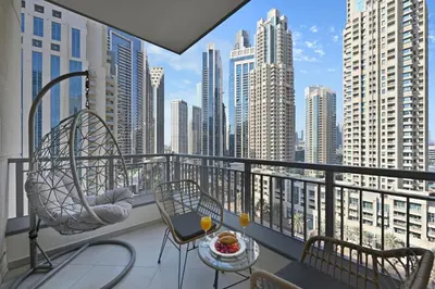 a balcony with a view of a city skyline at Luxury 2BR Downtown Walk to Dubai Mall Burj Khalifa in Dubai