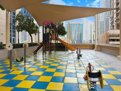 a playground on the roof of a building at Luxury 2BR Downtown Walk to Dubai Mall Burj Khalifa in Dubai