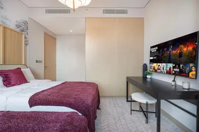 a hotel room with a bed and a desk at 4BR Luxury Hotel Amenities Dubai Mall Access in Dubai