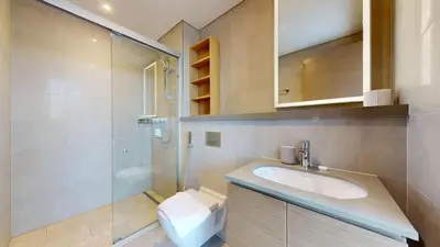 a bathroom with a sink and a shower at Vacationer l Contemporary 1 Bedroom l Free Pool, Gym Access in Dubai