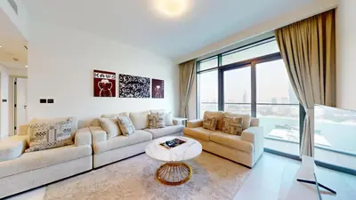 a living room with two couches and a table at Vacationer l Stunning 2 Bed l Marina Skyline l Beach Access in Dubai