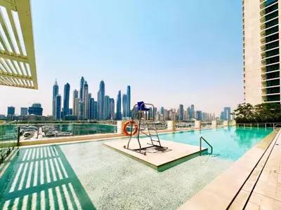 a swimming pool with a view of a city skyline at Vacationer l Stunning 2 Bed l Marina Skyline l Beach Access in Dubai
