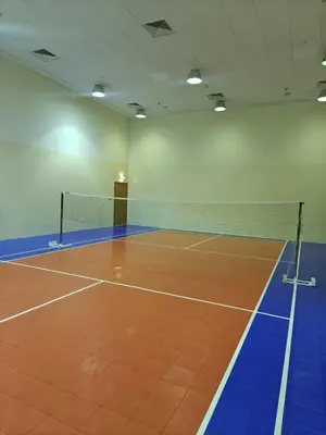 a tennis court with a net in a room at Clear Burj Khalifa View Large Downtown Studio in Dubai