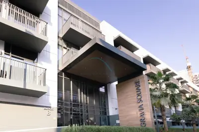 a rendering of the exterior of a building at Central Location with Easy Access to Al Khail Road, Near Bus Stops, Supermarkets, Dining Spots, Minutes from Dubai Marina and Downtown - Belgravia Square B, JVC by Deluxe Holiday Homes in Dubai