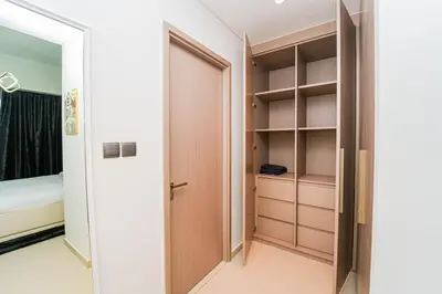 a room with a closet with a door and a bed at NYC x DXB with Full Burj Khalifa View in Downtown Dubai in Dubai