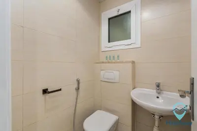 a bathroom with a sink and a toilet at Stunning 1BR l JLTl Steps to Metro! in Dubai