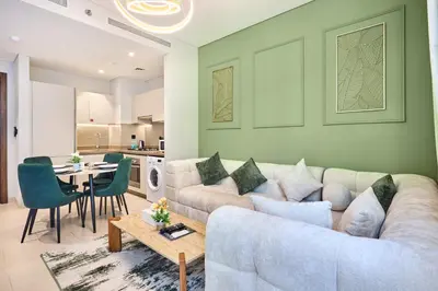 a living room with a couch and a table at STAY BY LATINEM Luxury 1BR Holiday Home CV B 1506 near Downtown in Dubai