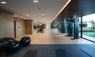 a gym with exercise equipment in a building at Tranquil 1BR in Binghatti Amber with Free Pool & Gym! in Dubai