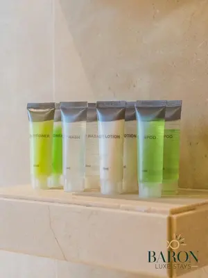 a row of four different colored hair products on a shelf at The Gallery in Dubai