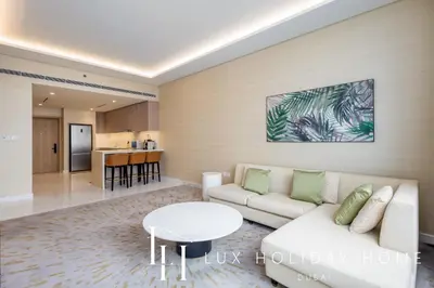 a living room with a couch and a table at LUX Iconic Views at The Palm Tower Suite 6 in Dubai