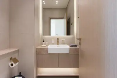 a bathroom with a sink and a mirror at Modern 1B with Private Jacuzzi Binghatti Phantom, JVC in Dubai