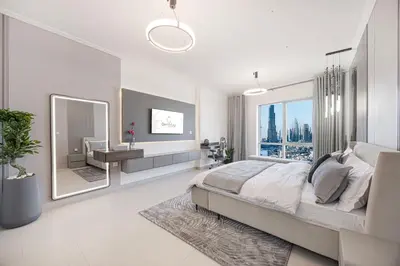 a white bedroom with a large bed and a mirror at Full Burj Khalifa Fountain View Near Dubai Mall Downtown in Dubai