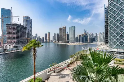 a view of a city with a river and buildings at Sleek Home in Business Bay with Panoramic Views in Dubai